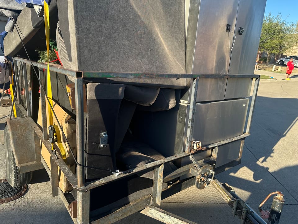 Professional FE Logistics trailer with secure strapping for DFW hauling job